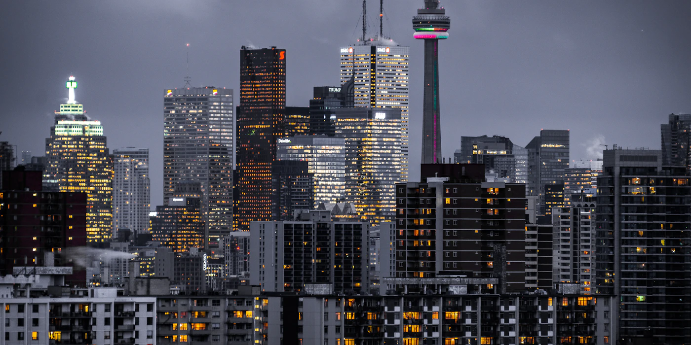 A dense skyline of high-rise towers at dusk, the way Jakarta's business districts rise above the city