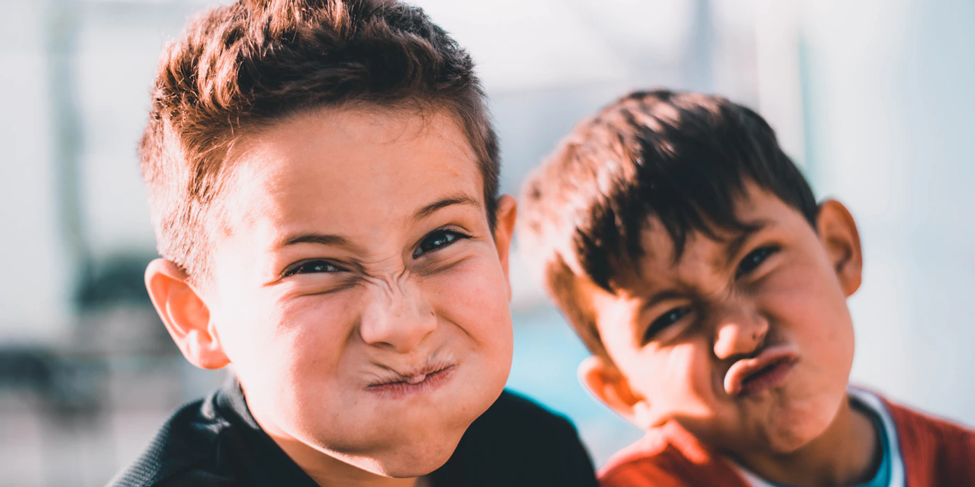 Person smiling confidently outdoors