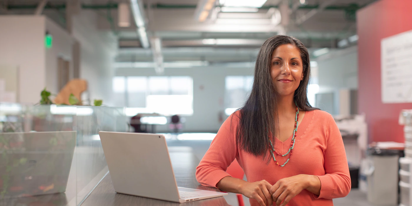 Person sitting alone with closed-off body language
